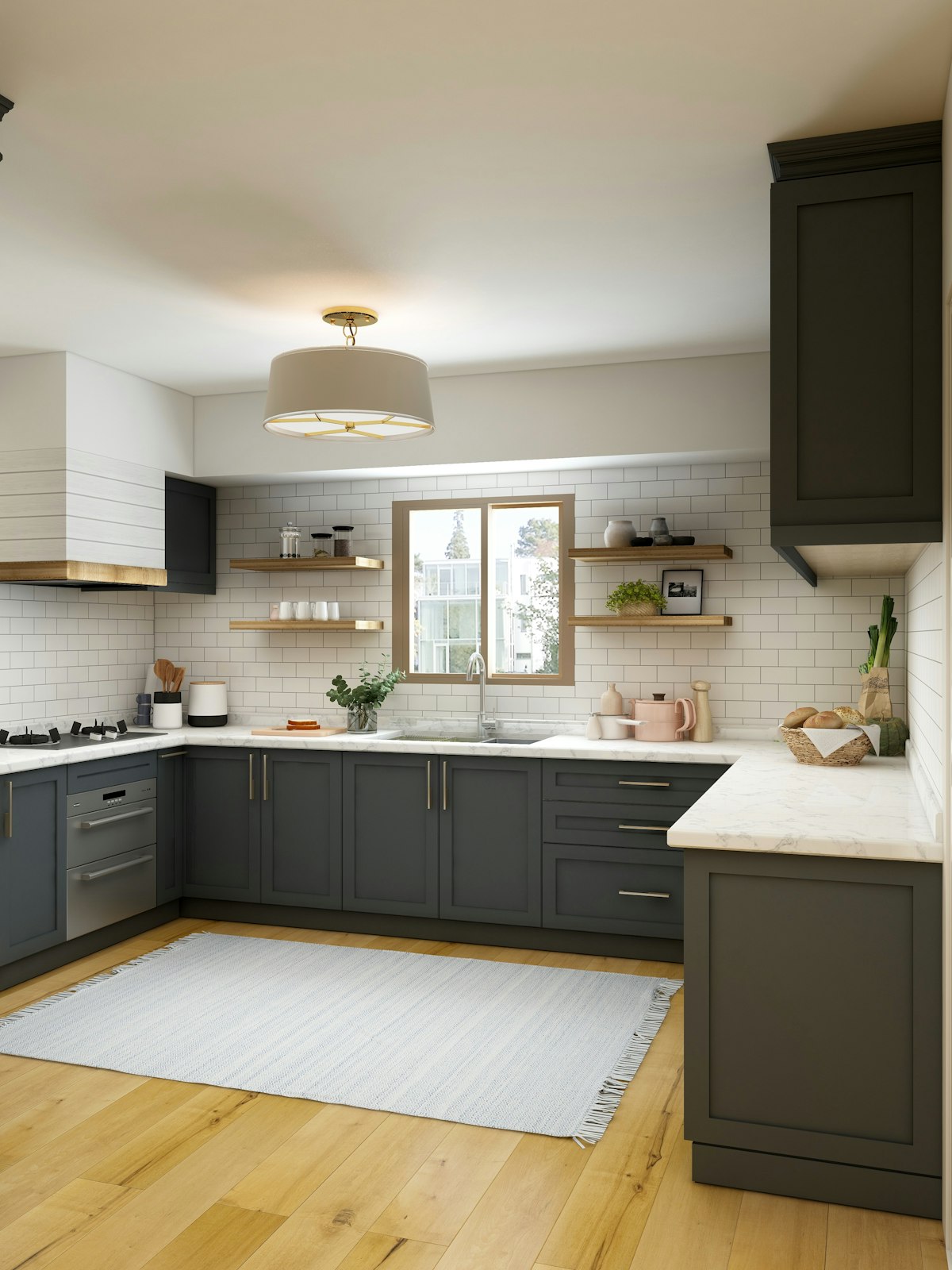 A compact kitchen with a flashing doorbell repeater on the wall.